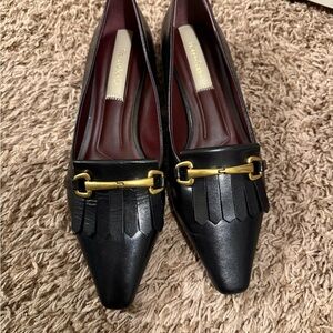 Tod's Black Flats with Pointed Toe and Gold Buckle